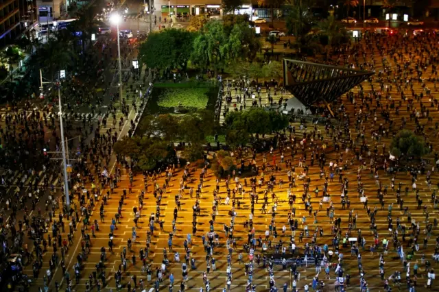 Protesters maintain social distancing at an anti-government rally in Tel Aviv