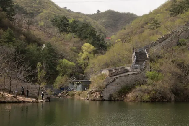 Visitors tour the Huanghuacheng Great Wall following its re-opening