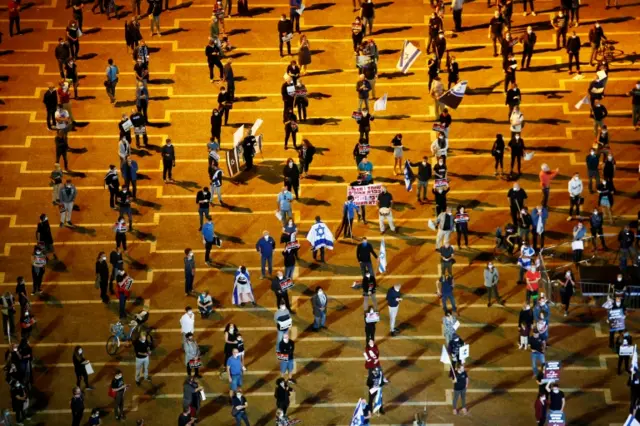 Protesters maintain social distancing at an anti-government rally in Tel Aviv