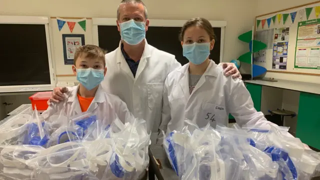 Dyfed Thomas with two pupils and PPE