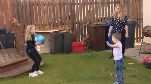 Medical student Amy McGirk with children she looks after