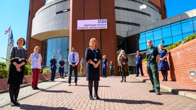 Staff outside the hospital