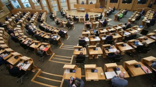 Half of the chairs have been removed from the Holyrood chamber to enforce social distancing