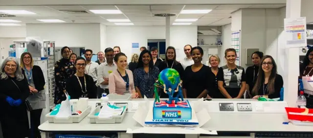 Staff at the hospital with the cakes