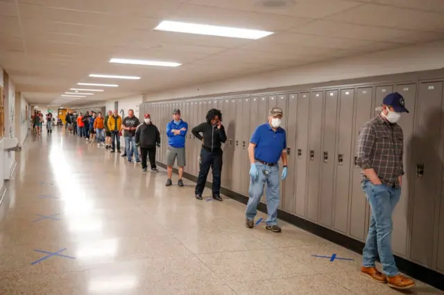 Voters line up in a Wisconsin high school