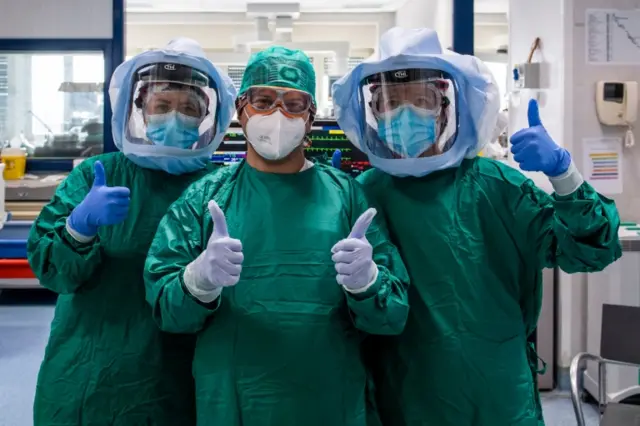 Italian doctors giving the thumbs up