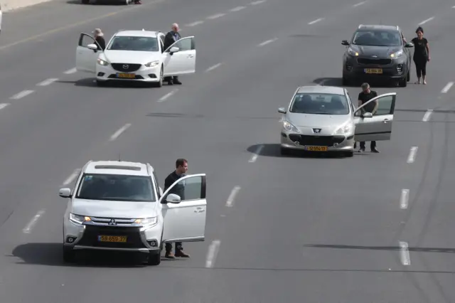 Israelis stand in silence beside their cars to mark Holocaust Remembrance Day in Tel Aviv on 21 April 2020