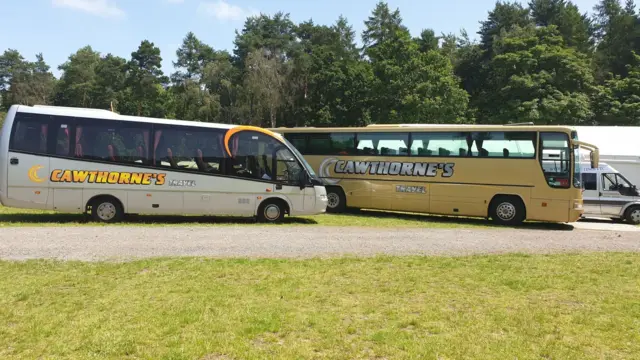 Two of the firm's buses