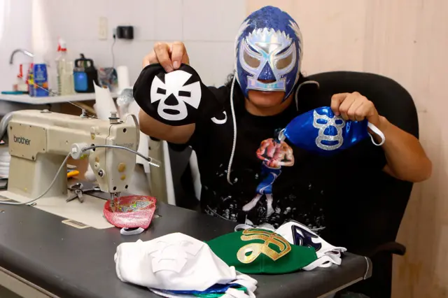 Lucha Libre wrestler 'El Hijo del Soberano' has pivoted to sewing face masks with his family in Torreon, Mexico