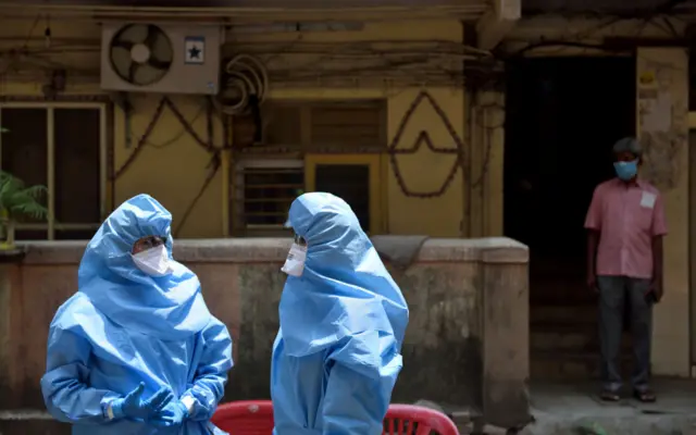 Doctors conducting Covid-19 test at Mahim Police colony - April 17, Mumbai, India.