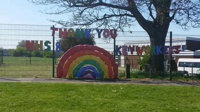 Rainbow on a fence