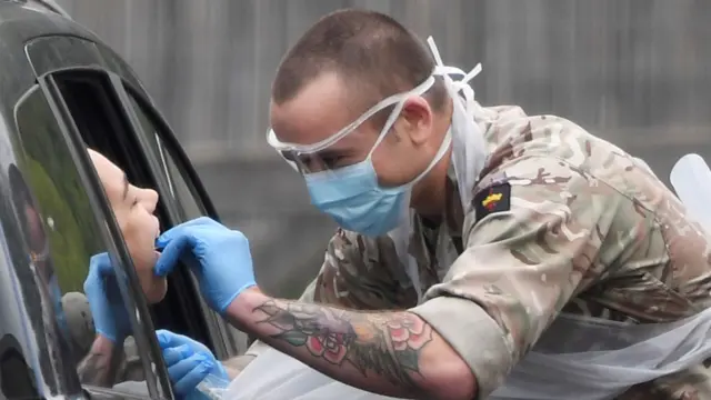 A soldier takes a swab for a Covid-19 test