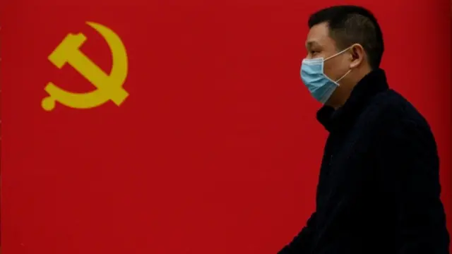 Chinese flag and man with face mask