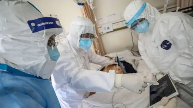 Chinese doctors treating patient