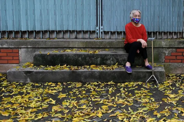 A woman wears a face mask, Hanoi