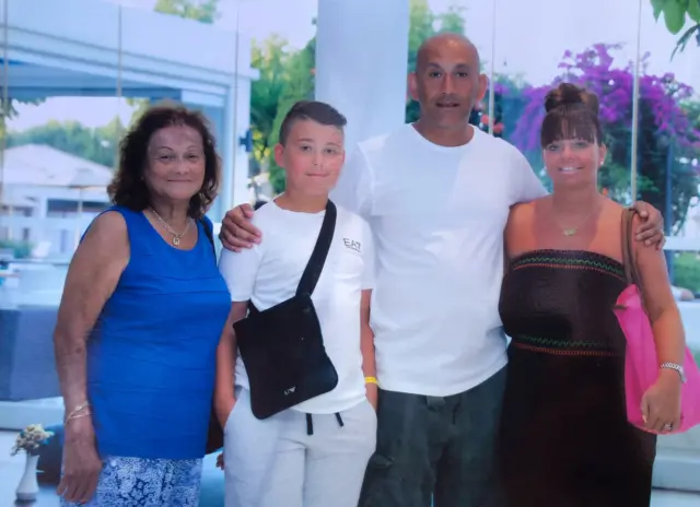 Sophie Fagan (left) with her grandson Jack, son John and his wife, Dani.