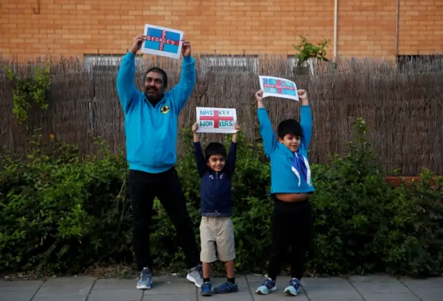 Leader of The Saints Beavers group Amit Sathawane and his son Arjun wearing their Beaver Scouts Uniform as they show their appreciation in Milton Keynes