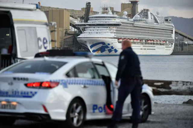 A police car in front of the Ruby Princess docked in Port Kembla