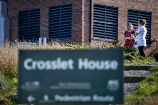 Workers outside Crosslet House care home in Dumbarton where 15 residents are understood to have died of coronavirus