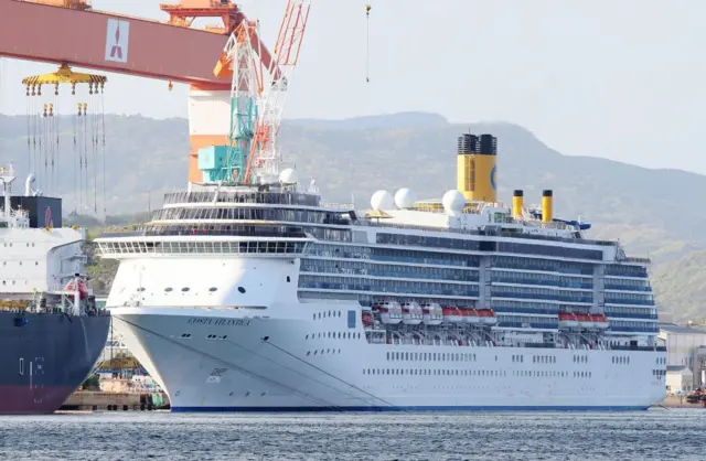 In this picture taken on April 22, 2020, cruise ship Costa Atlantica is docked at a port in Nagasaki.