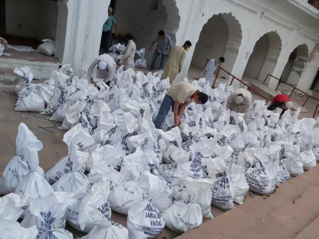 Volunteers packing ration kits