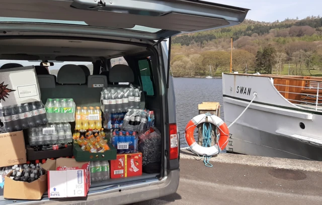 van loaded with drinks next to steamer Swan