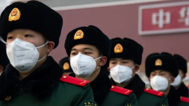 Chinese police wearing face masks