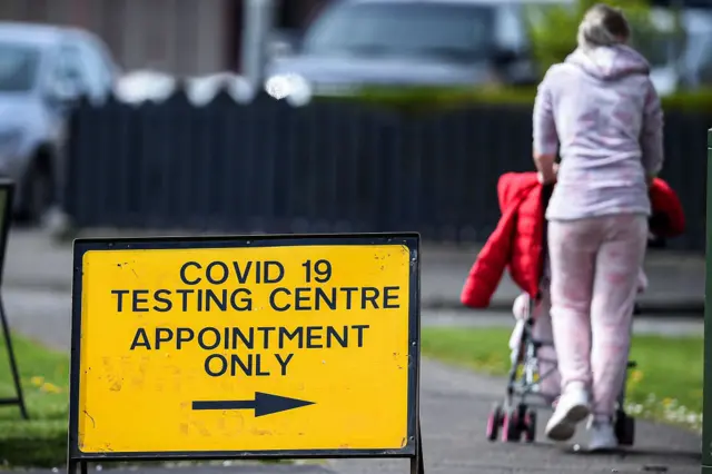 A woman walks past a covid -19 testing centre for NHS staff sign on April 23, 2020 in Grangemouth, United Kingdom.