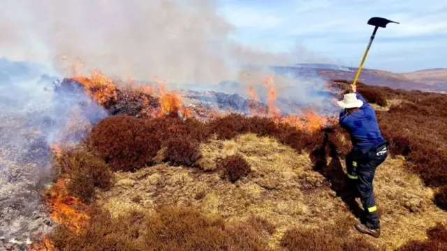 Firefighter tackles moorland fire