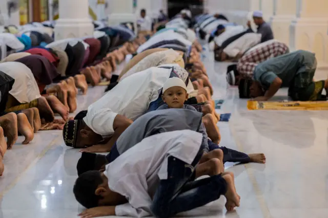 Muslim devotees offer prayers on the first night of Ramadan, in Bireuen of Aceh province on April 23, 2020.