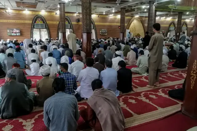 Muslims offer Friday prayers at the Red Mosque during a government-imposed nationwide lockdown as a preventive measure against the COVID-19 coronavirus, in Islamabad on April 17, 2020