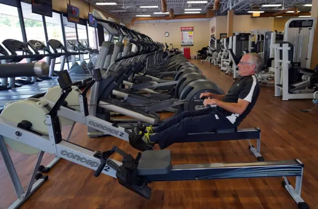 Steve Hall, one of two people at the gym, works out at Fitness 19 in Lilburn, Georgia on 24 April, 2020