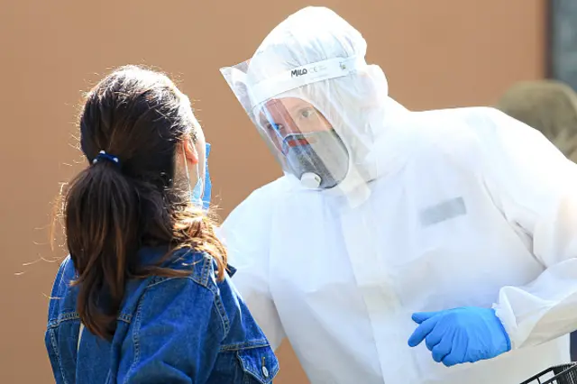 A healthcare professional performs a drive-through swab to detect Covid-19 in Italy