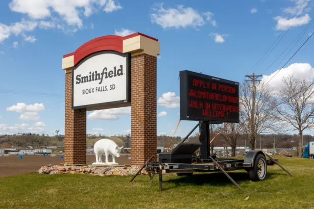 A sign outside the Smithfield Foods pork processing plant in South Dakota, one of the countrys largest known Coronavirus clusters, is seen on 21 April, 2020 in Sioux Falls, South Dakota