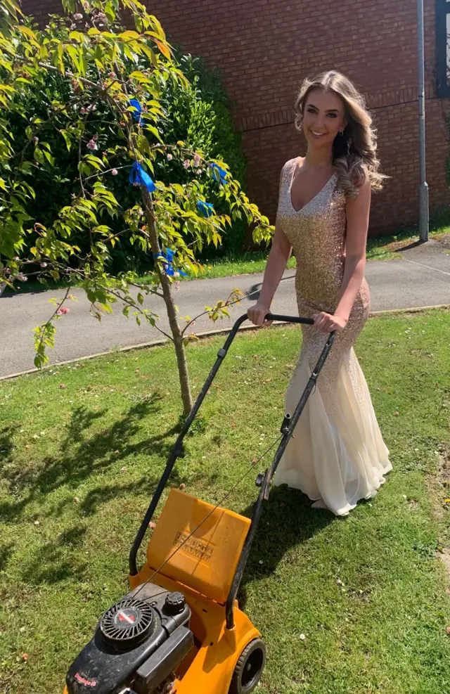 Olivia Harris mows the lawn