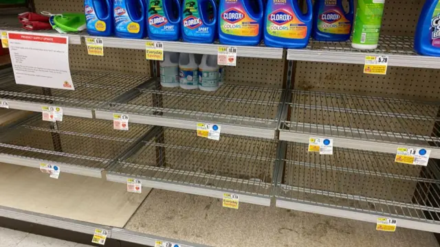 Empty supermarket shelves showing that many cleaning products have sold out