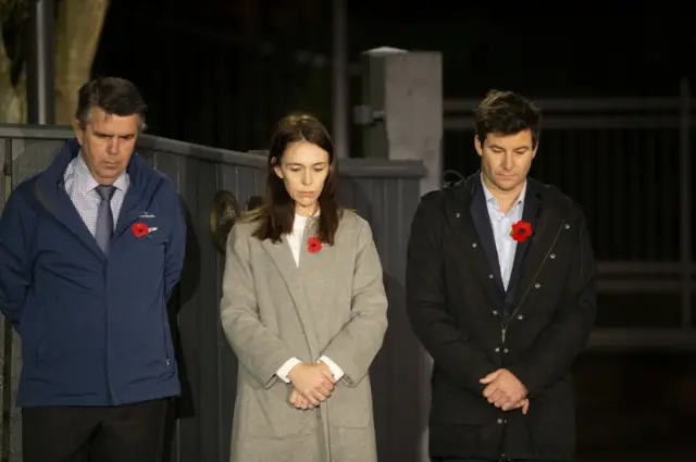 Jacinda Ardern pictured with her partner and father outside her house