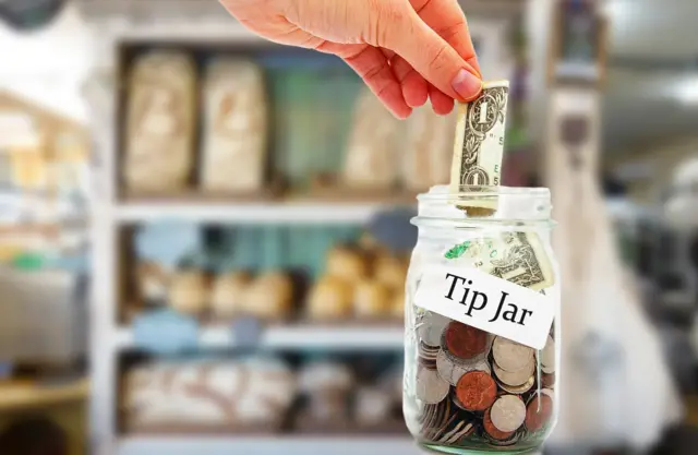 Stock photo of a tip jar