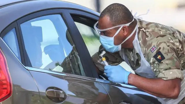 A soldier carrying out testing