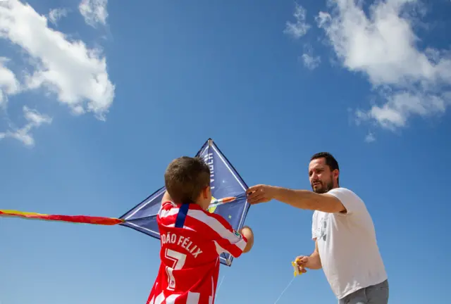 Boy plays with kite