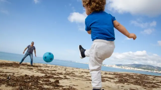 Child playing football