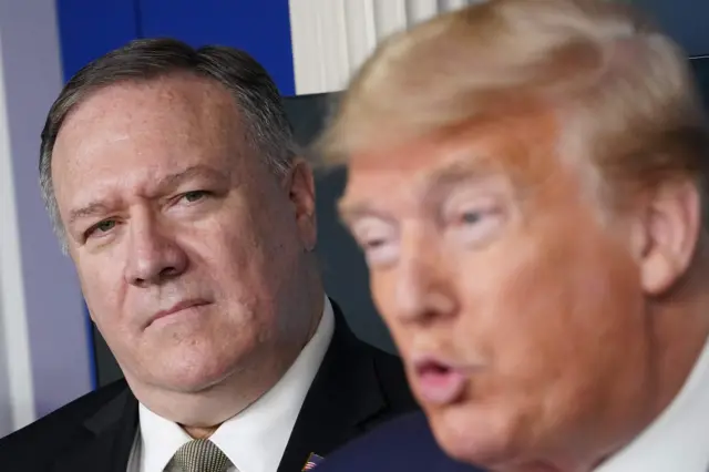 S Secretary of States Mike Pompeo listens as US President Donald Trump speaks during the daily briefing on the novel coronavirus, COVID-19, in the Brady Briefing Room at the White House on April 8, 2020