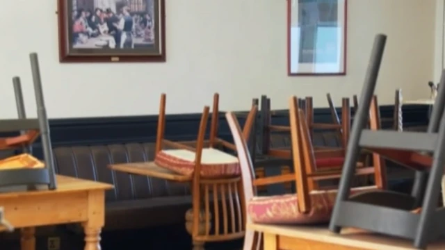 Upturned chairs on pub tables