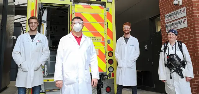 Swansea students and an ambulance