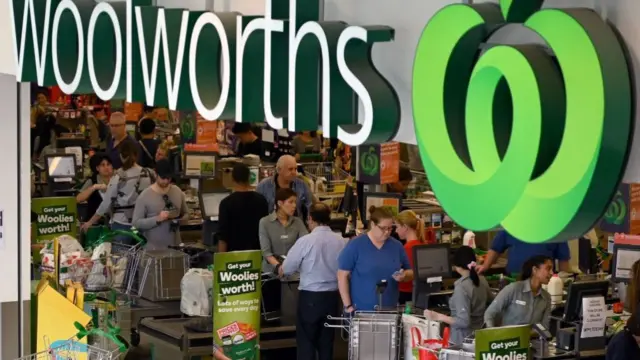 Shoppers at check-out counters in an Australian supermarket during the pandemic