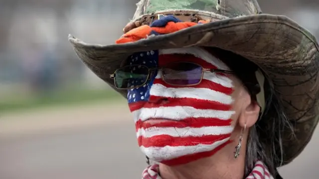 Woman with US flag painted on her face