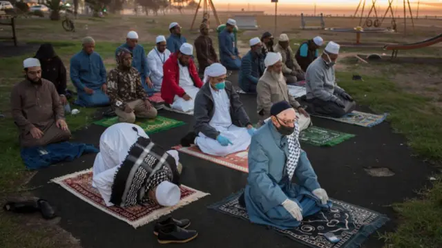 Muslim clerics pray before looking for the crescent moon in Cape Town