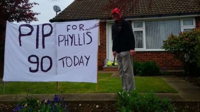 Barrie with the sign