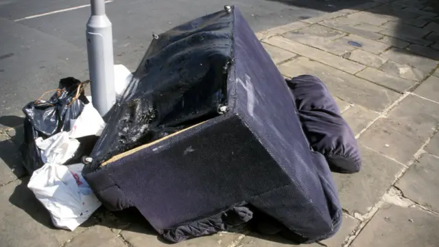 A sofa on a street