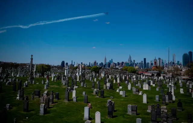 The Blue Angels (top) and Thunderbirds fly over New York in a salute to health care workers on 28 April, 2020